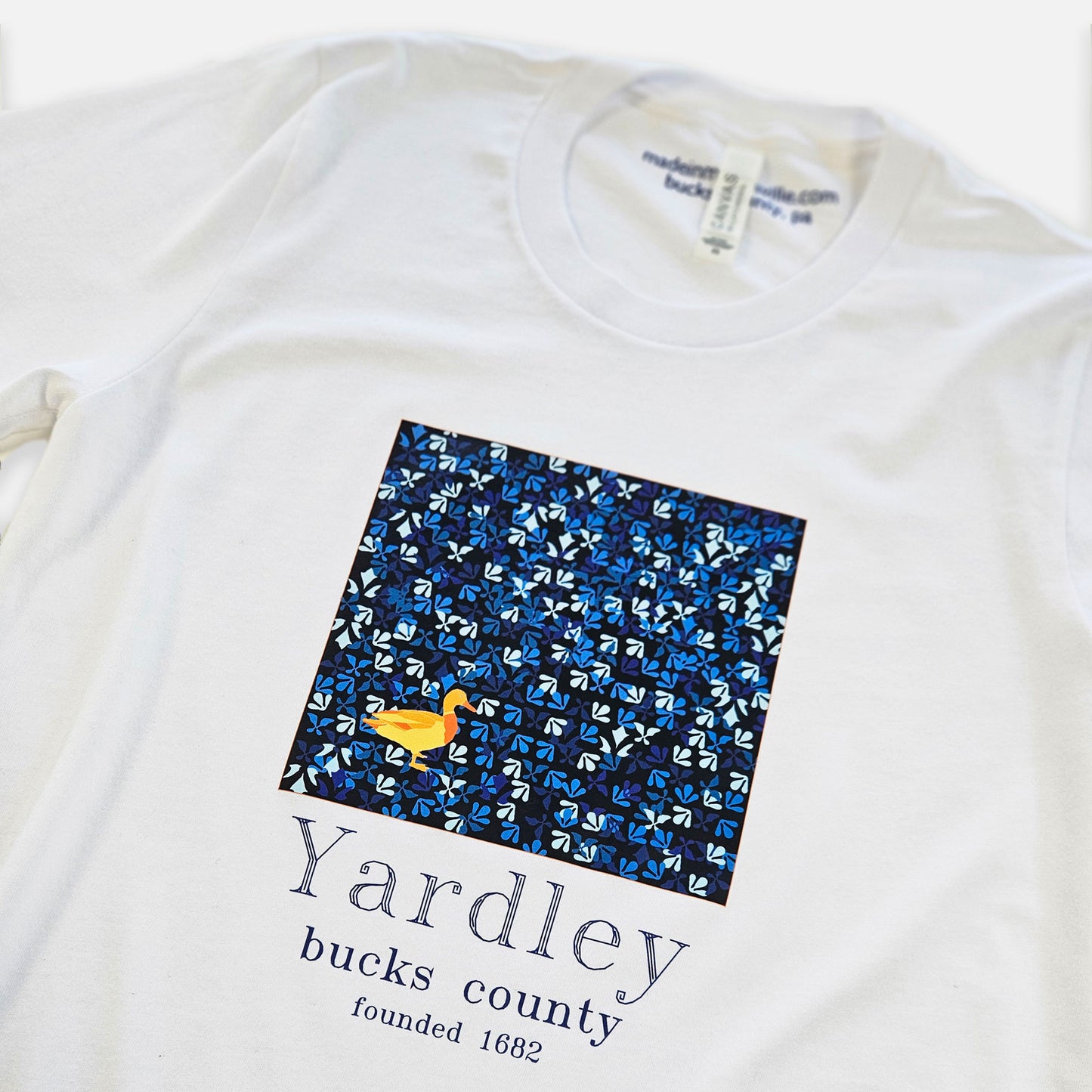Duck / Yardley on blue Lenape camouflage background graphic T-shirt - white