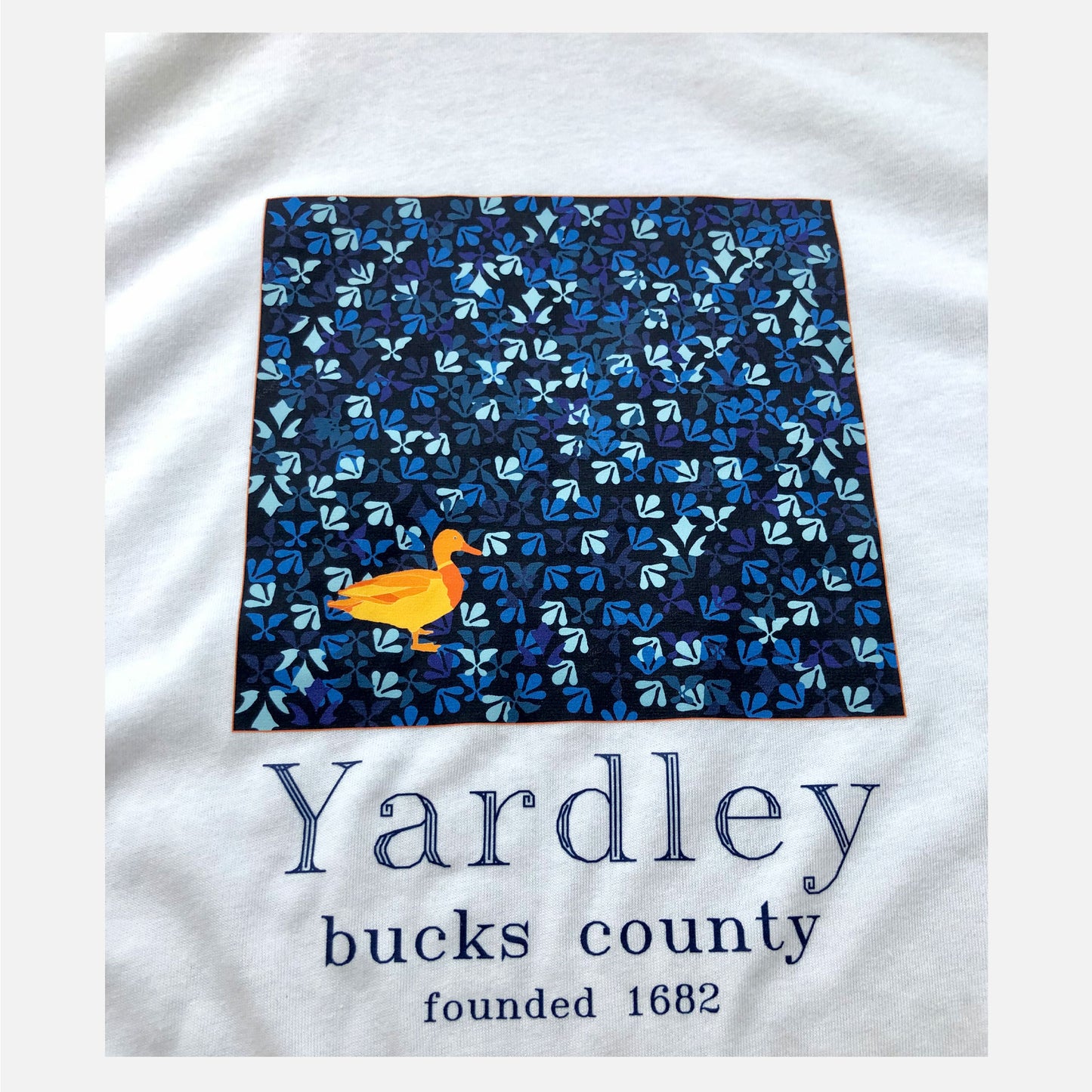 Duck / Yardley on blue Lenape camouflage background graphic T-shirt - white